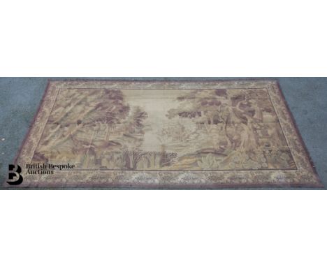 A large antique tapestry depicting an extensive landscape with shepherd and sheep in the distance, enclosed by a floral borde