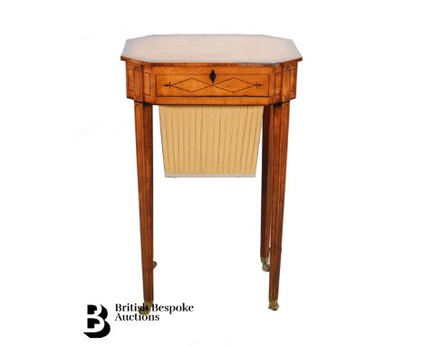 Regency satinwood inlaid sewing table, the inlaid top opens to reveal a plaited silk well, with chamfered corners and decorat