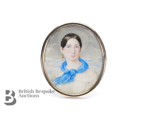 19th century oval portrait miniature of a young woman wearing a blue scarf, approx 45 x 28mm.