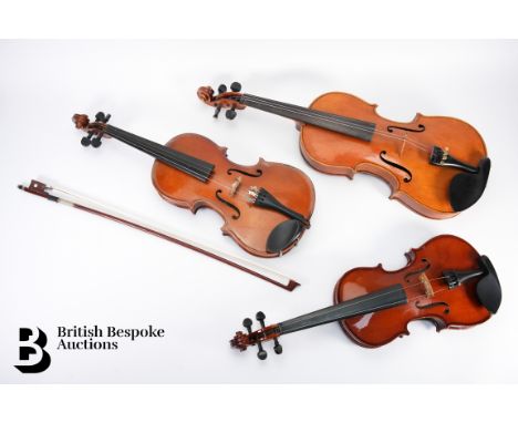 Three cased violins, including a child's 1/4 violin (unmarked), Chinese Lark child's violin (marked) and a cased 3/4 violin (