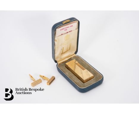 Dunhill Rollagas lighter, housed in the original box together with a pair of gold plated cufflinks.&nbsp;