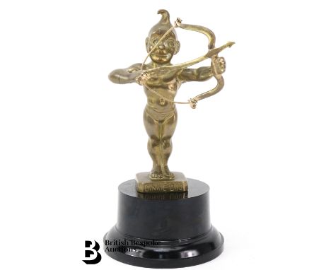 An early Edwardian brass Dinkie Doo radiator mascot, featuring the character with his bow and arrow.

-