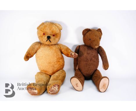 Two early 20th century bears, the first dark brown straw-filled with jointed limbs, button eyes and thread nose and mouth app