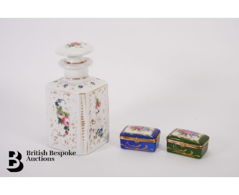 A porcelain perfume bottle and stopper, late 19th century, painted with floral spray and heightened with gilt approx 16 cms h