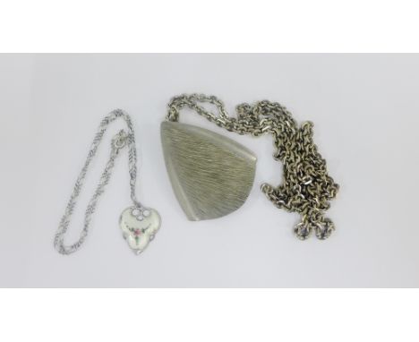 Danish pewter pendant on chain together with a silver and enamel pendant on chain (2) 