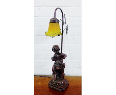 Art Nouveau style figural table lamp base with a yellow art glass shade, 56cm high