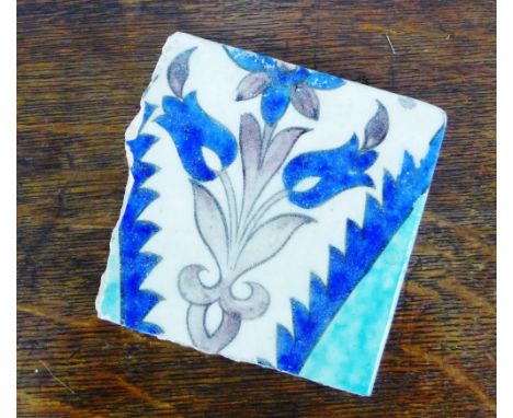Isnik style tile with floral motif in blue, white and green, 11cm square