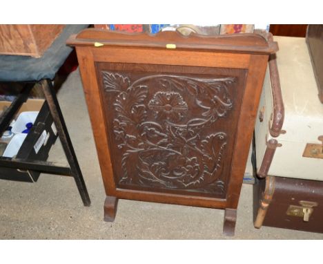 A carved mahogany firescreen