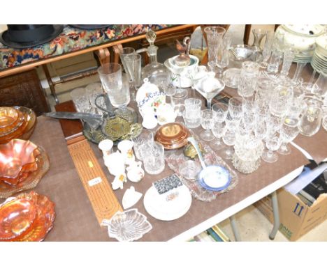 A collection of various china and glassware to include crested souvenir ware, a Victorian ladle, table glassware, horse brass