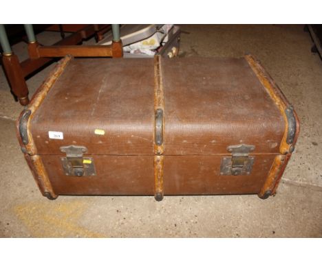 A vintage canvas and battened trunk