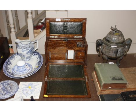 A late 19th / early 20th Century oak stationery box with plated inkwell and key