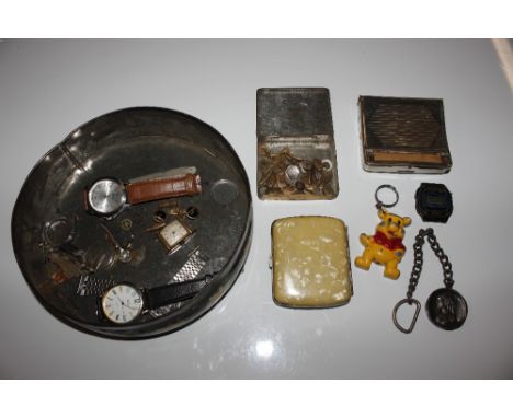 A tin containing various watches, a cigarette case, a Rupert Bear figure etc.