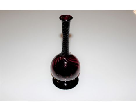 An amethyst glass vase with twist decoration
