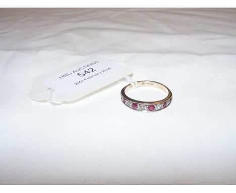 A diamond and ruby half eternity ring