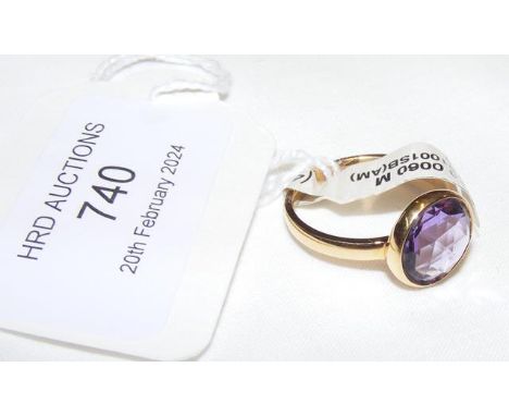 An amethyst ring in 18ct setting - approx. size K/L