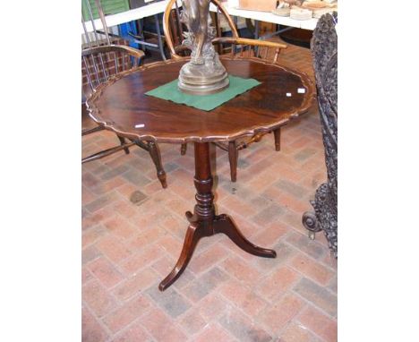 An antique mahogany tripod table on turned support - 76cm diameter