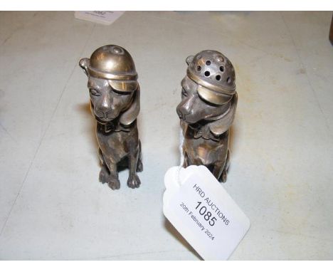 A pair of silver salt and pepper shakers in the form of dogs