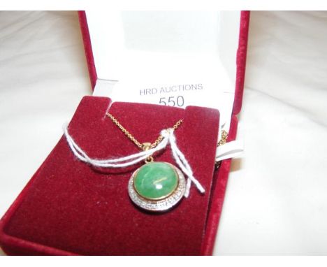 A jade and diamond circular pendant on gold chain CONDITION REPORT We have attached a number of additional images to showcase