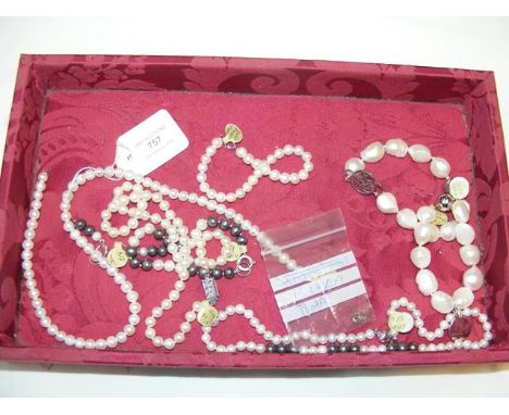 A selection of pearl bracelets, necklaces