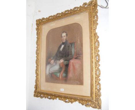 A pastel portrait of seated gentleman in decorative gilt frame, signed lower right