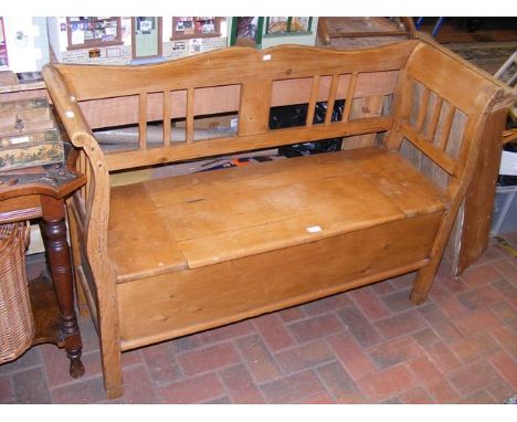 An antique pine hall bench with storage beneath seat - width approx. 127cms