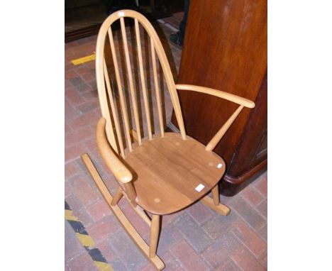 An Ercol stick-back rocking chair