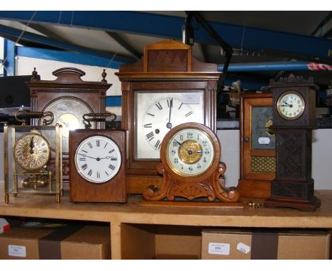 An antique mantel clock together with others