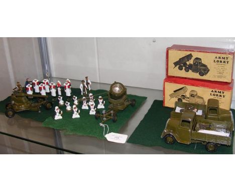 A boxed Britain army lorry and one other, together with a selection of Britain's cast metal nurses etc.