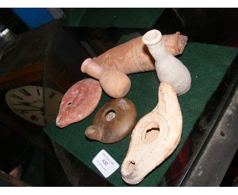 A Roman terracotta oil lamp, together with other Roman pottery