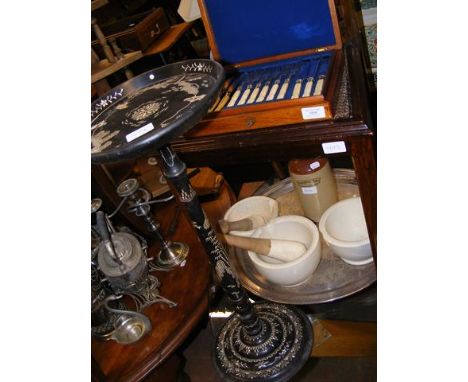 A canteen of cutlery, a ebonised plant stand with mother of pearl inlay, pestle and mortars etc.