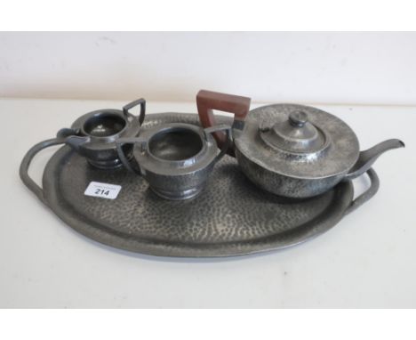 A Lion hammered pewter three piece tea service with Bakelite handle, on similar K&amp;D oval pewter tray (4) 