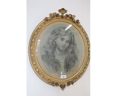 19th century half length portrait of a young girl, pencil with white, oval in giltwood and gesso frame (52 x 44cm) 