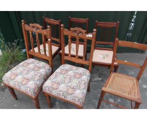 Pair of Edwardian golden oak dining chairs with tapestry style seats, three mahogany bedroom chairs with needlework seats, an