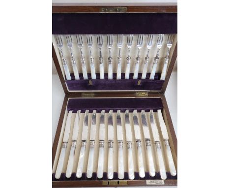 Set of twelve EPNS dessert knives &amp; forks with Mother of Pearl handles, in fitted case by Walker &amp; Hall 