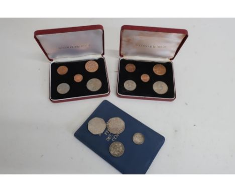 Two 1994 D-Day commemorative 50p pieces, 1948 shilling, 1928 sixpence, and two Britain's First Decimal Coin folder sets