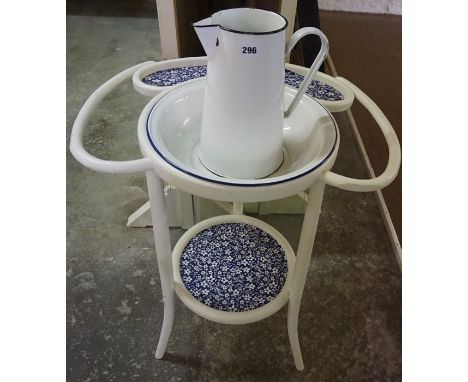 A Vintage Enamel Toilet Jug with Bowl, Raised on a fitted painted two tier stand, overall approximately 105cm high