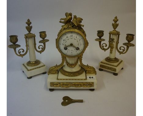 A French Gilt Metal and Marble Three Piece Clock Garniture, circa late 19th century, The drum head clock having two birds to 