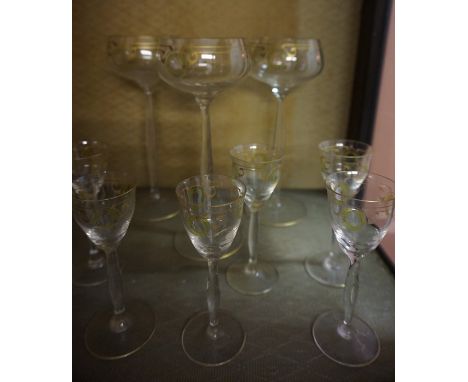 A Suite of Continental Enamel Decorated Glasses, to include decanter, champagne glasses, wine glasses, finger bowls, liqueur 