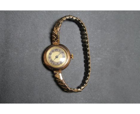 A VINTAGE HALLMARKED 9 CARAT GOLD WRIST WATCH,  on expanding plated bracelet, Dia 2.5 cm
