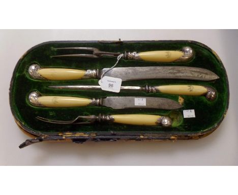 An Edwardian five piece silver mounted ivory handled five piece carving set, crests engraved to ivory handles, scrolling foli