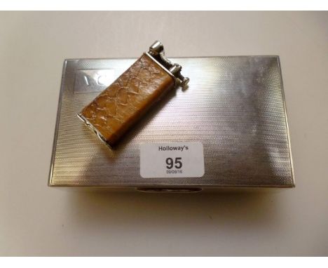 Poston Products Ltd., a silver rectangular cigarette box, engine turned hinged lid an A A Long Service Award engraved to fron