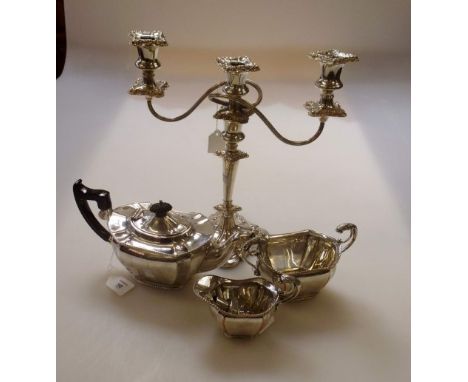 A silver plated three piece teaset, of panelled oval form, with gadrooned borders and leaf capped flying scroll handles, toge