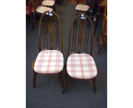 A set of six Ercol-type hoop and stick back armchairs, each with Inglesants label to seat