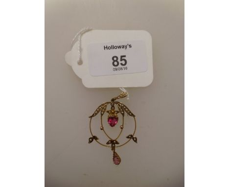 An Edwardian synthetic ruby, topaz and seed pearl openwork pendant, with central heart-shaped ruby and leaf-mounted circular 