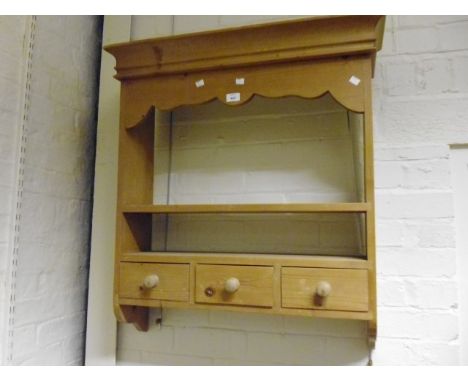 A pine kitchen plate rack, with single shelf over three drawers