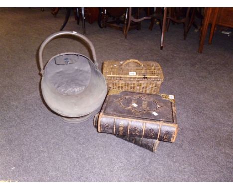 A gilt metal bound late 19th century family illustrated bible, and one other, together with a wicker basket and a helmet coal