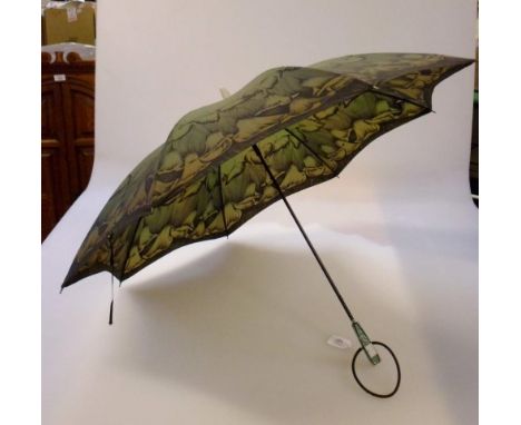 A circa 1930s lady’s umbrella/parasol, the olive sateen canopy decorated with lilies, supported by a simulated wood stick, fa