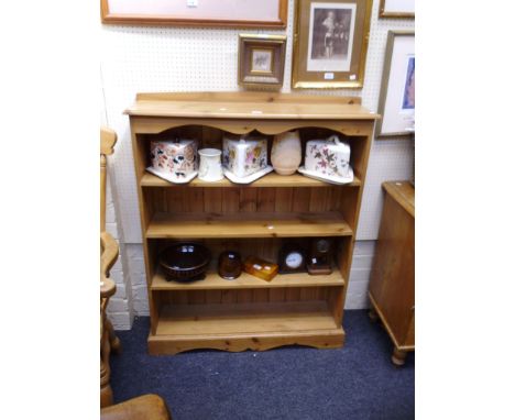 A pine four shelf open bookcase