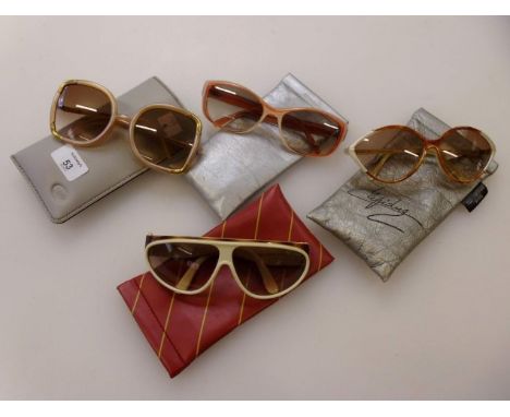 A collection of four pairs of ladies designer sunglasses, to include a pair of vintage oversized Ted Lapidus of Paris, a vint