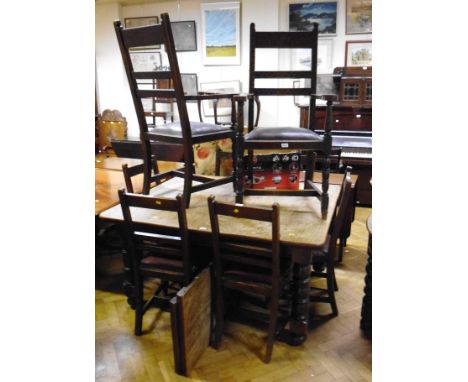 A late Victorian oak extending dining table, the rectangular top with moulded edge and two extra leaves on bobbin, reel and b